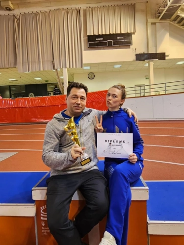 Анна Максименко із тренером Андрієм Орліковським